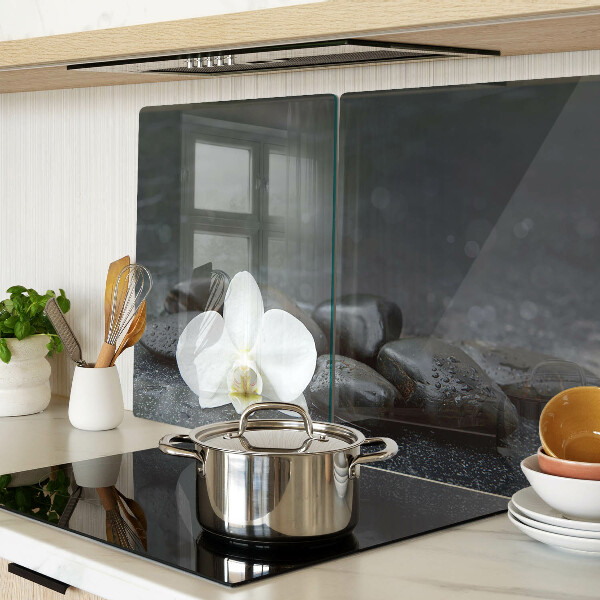 Szklana deska do krojenia z motywem kwiatu orchidei na kamieniach