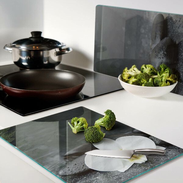 Szklana deska do krojenia z motywem kwiatu orchidei na kamieniach