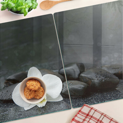 Szklana deska do krojenia z motywem kwiatu orchidei na kamieniach