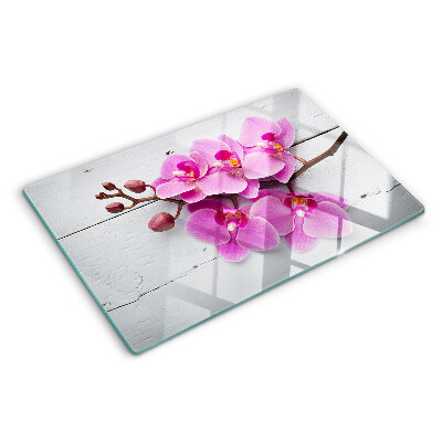 Szklana deska do krojenia z motywem orchidei na białym tle