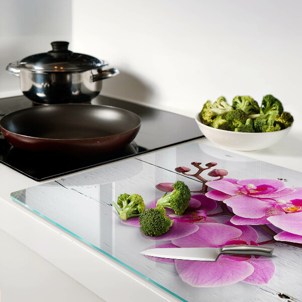 Szklana deska do krojenia z motywem orchidei na białym tle