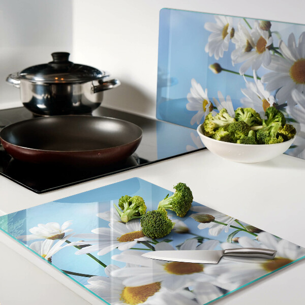 Szklana deska do krojenia z motywem stokrotek na niebieskim tle