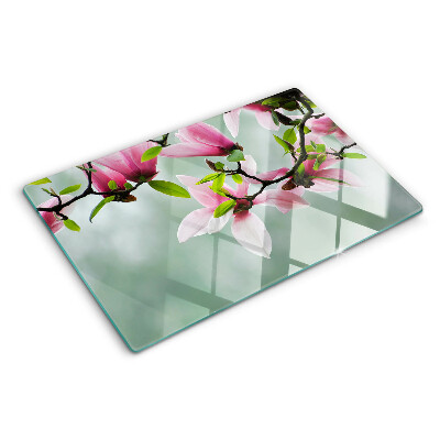Szklana deska do krojenia z motywem kwiatów magnolii na zielonym tle