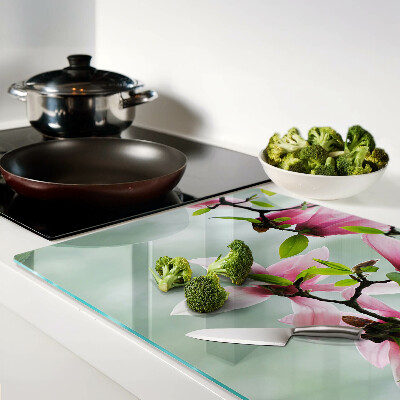 Szklana deska do krojenia z motywem kwiatów magnolii na zielonym tle