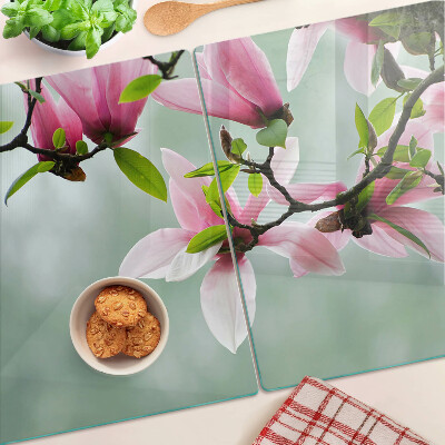 Szklana deska do krojenia z motywem kwiatów magnolii na zielonym tle