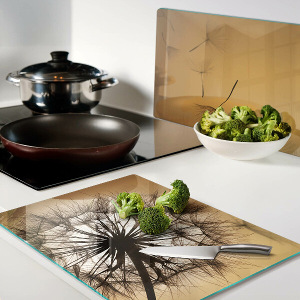 Deska kuchenna szklana z motywem dmuchawców na tle zachodu słońca