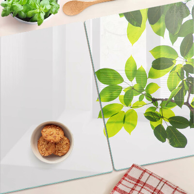 Szklana deska do krojenia z motywem liści na jasnym tle