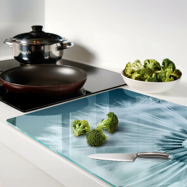 Szklana deska do krojenia z nadrukiem dmuchawców na tle nieba