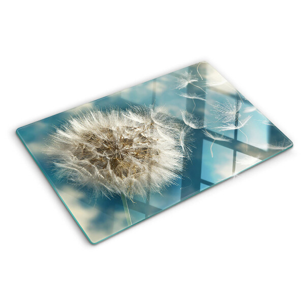 Szklana deska kuchenna z nadrukiem dmuchawców na tle błękitnego nieba