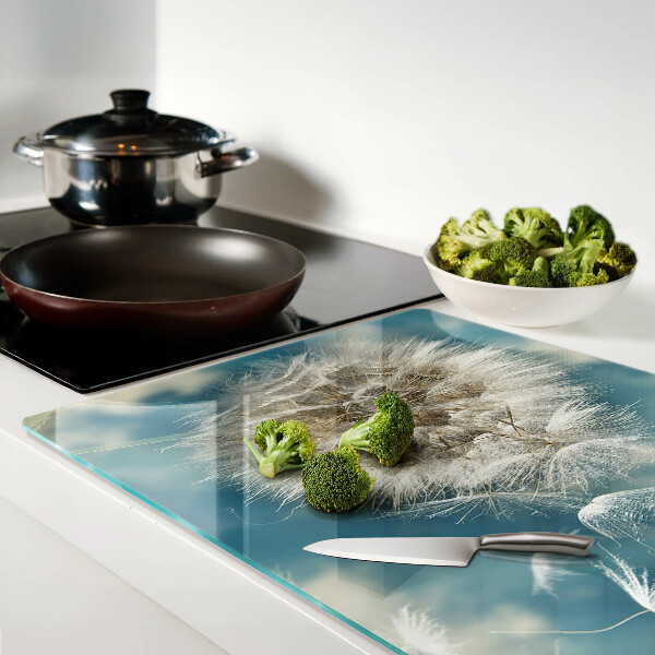 Szklana deska kuchenna z nadrukiem dmuchawców na tle błękitnego nieba