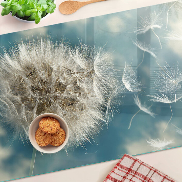 Szklana deska kuchenna z nadrukiem dmuchawców na tle błękitnego nieba