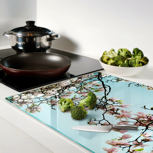 Deska kuchenna szklana z motywem kwiatów magnolii na niebieskim tle
