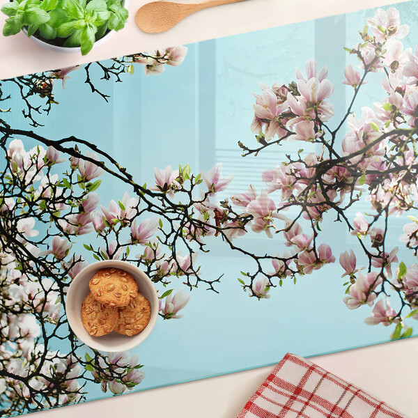 Deska kuchenna szklana z motywem kwiatów magnolii na niebieskim tle