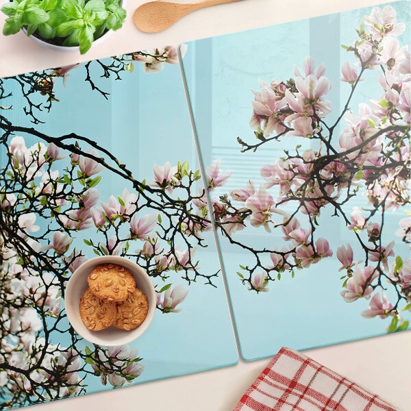 Deska kuchenna szklana z motywem kwiatów magnolii na niebieskim tle