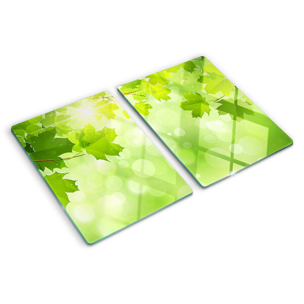 Szklana deska do krojenia z motywem liści w promieniach słońca