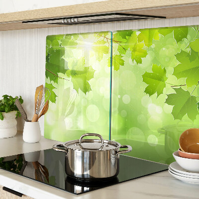 Szklana deska do krojenia z motywem liści w promieniach słońca