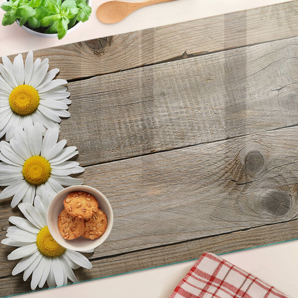 Szklana deska do krojenia z motywem kwiatów na tle drewna