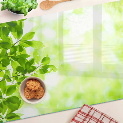 Szklana deska do krojenia z motywem zielonych liści o jasnym podświetleniu