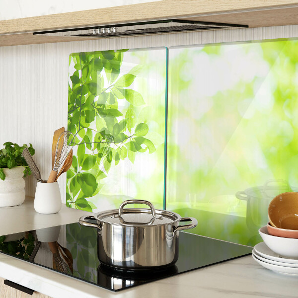 Szklana deska do krojenia z motywem zielonych liści o jasnym podświetleniu