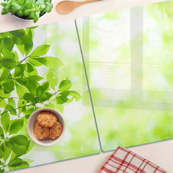 Szklana deska do krojenia z motywem zielonych liści o jasnym podświetleniu