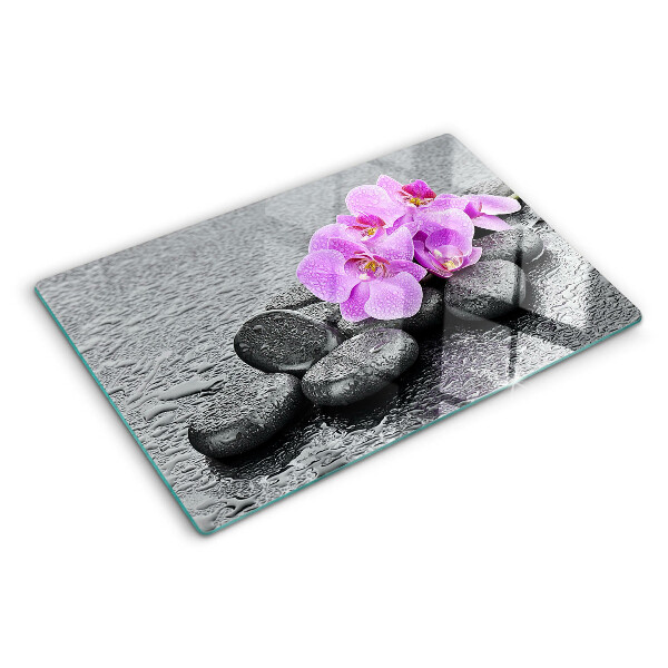 Szklana deska do krojenia z motywem kwiatów i kamieni na tle wody