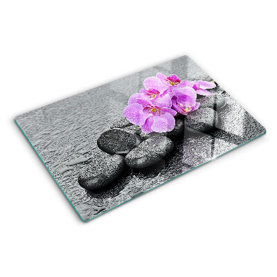 Szklana deska do krojenia z motywem kwiatów i kamieni na tle wody