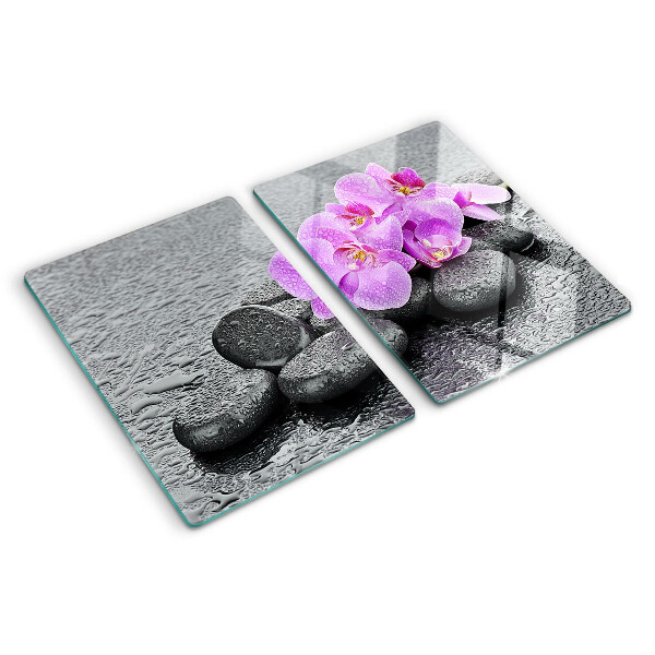 Szklana deska do krojenia z motywem kwiatów i kamieni na tle wody