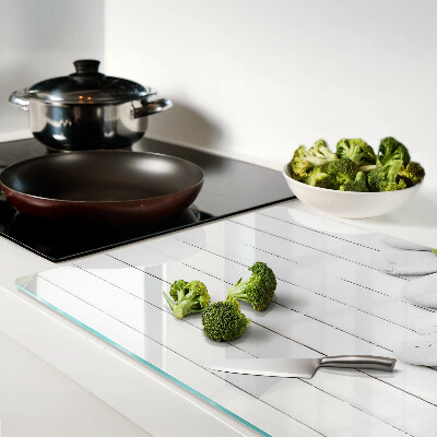 Szklana deska do krojenia z wzorem bambusa i kamieni na tle drewna