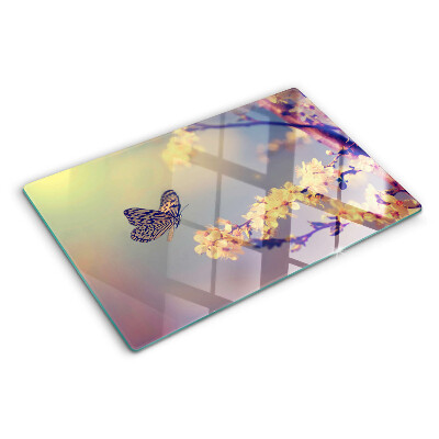 Szklana deska kuchenna z motywem motyla na tle kwiatów