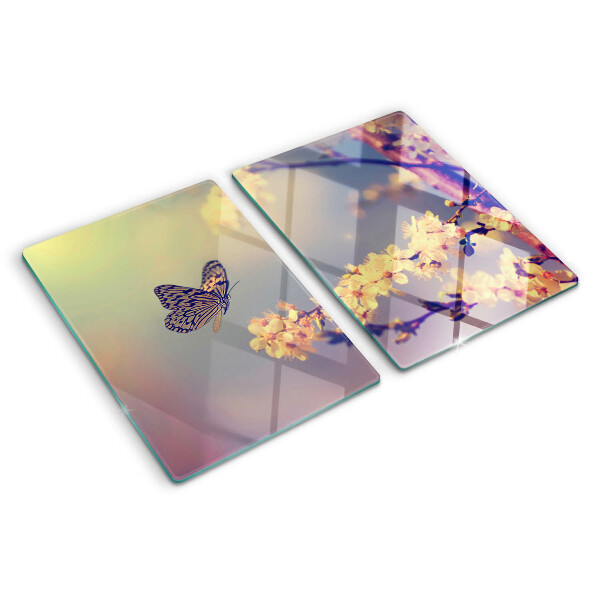 Szklana deska kuchenna z motywem motyla na tle kwiatów