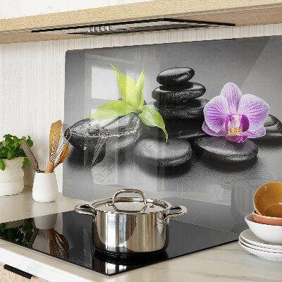 Deska kuchenna szklana z motywem kamieni i orchidei na tle