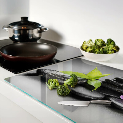 Deska kuchenna szklana z motywem kamieni i orchidei na tle