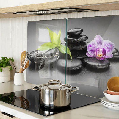Deska kuchenna szklana z motywem kamieni i orchidei na tle