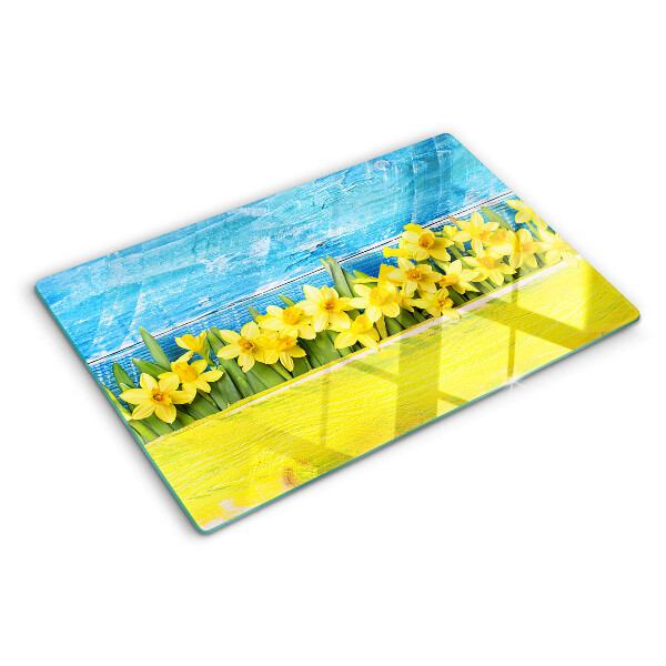 Szklana deska kuchenna z motywem żonkili na tle nieba