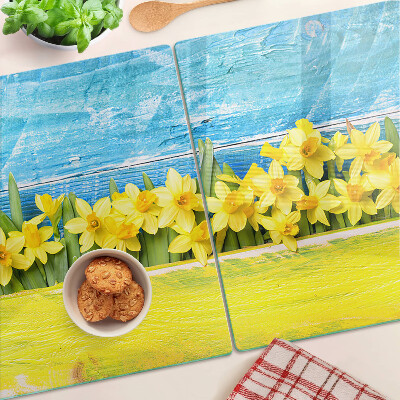 Szklana deska kuchenna z motywem żonkili na tle nieba