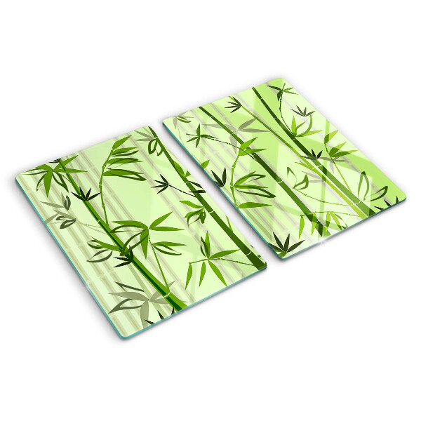 Szklana deska do krojenia z bambusowym spodem na zielonym tle