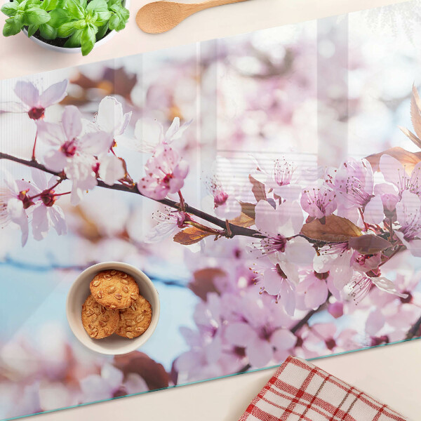 Deska kuchenna szklana z motywem kwiatów wiśni na niebieskim tle