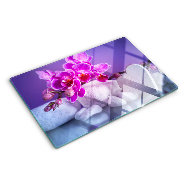 Szklana deska do krojenia z motywem orchidei na kamieniach