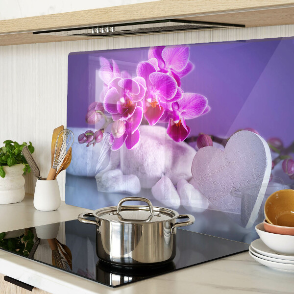 Szklana deska do krojenia z motywem orchidei na kamieniach