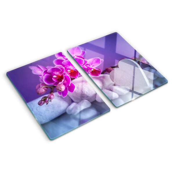 Szklana deska do krojenia z motywem orchidei na kamieniach