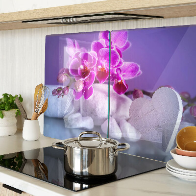 Szklana deska do krojenia z motywem orchidei na kamieniach