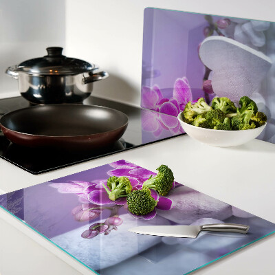 Szklana deska do krojenia z motywem orchidei na kamieniach