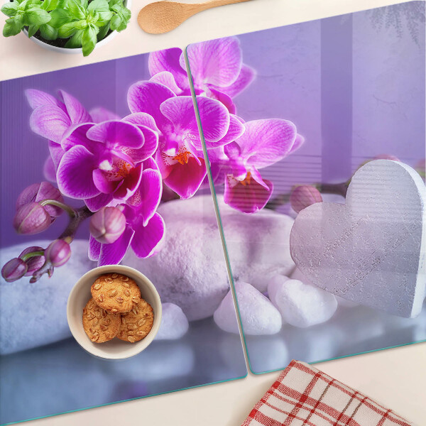 Szklana deska do krojenia z motywem orchidei na kamieniach