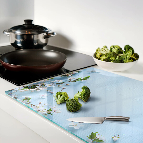 Szklana deska do krojenia z kwiatowym wzorem na niebieskim tle