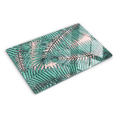 Deska kuchenna szklana z motywem liści palmowych na różowym tle