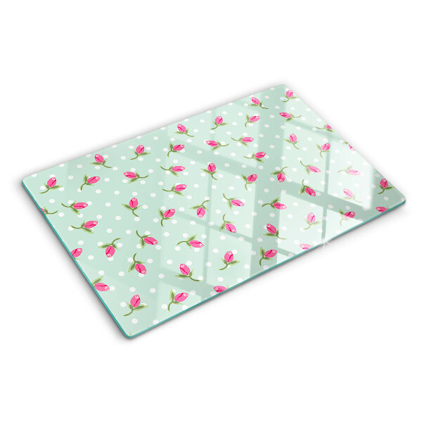 Szklana deska kuchenna z różowymi tulipanami na zielonym tle
