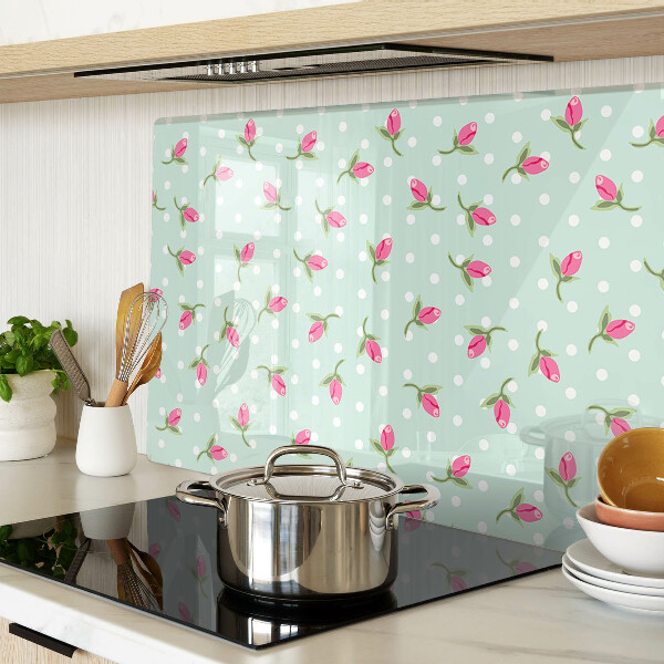 Szklana deska kuchenna z różowymi tulipanami na zielonym tle