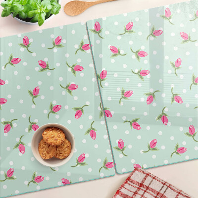 Szklana deska kuchenna z różowymi tulipanami na zielonym tle