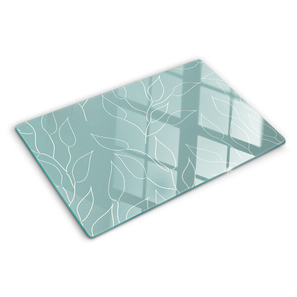 Szklana deska kuchenna z motywem liści na tle