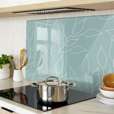 Szklana deska kuchenna z motywem liści na tle